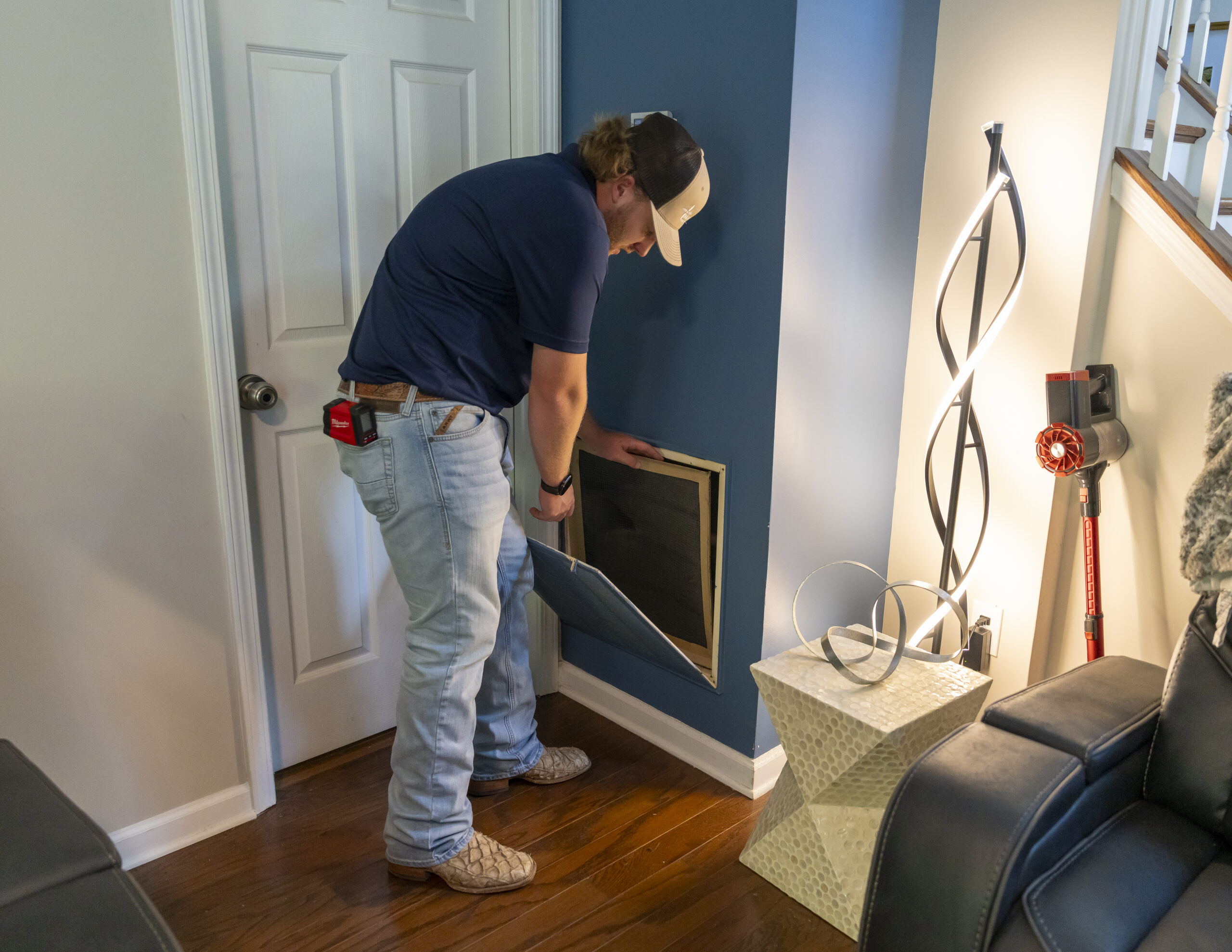 Mandolin Services technician preparing residential HVAC equipment for seasonal AC maintenance in North Carolina
