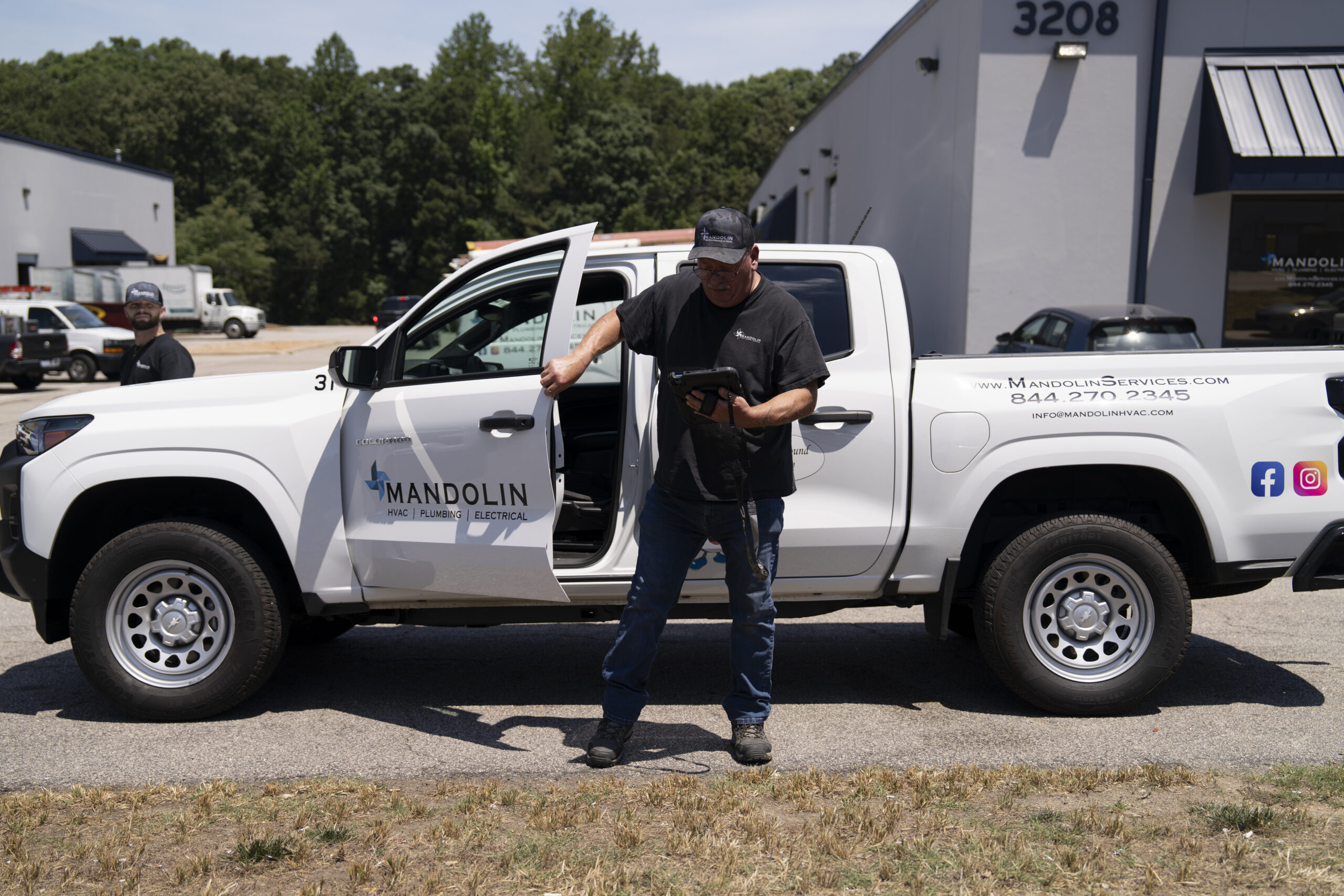 Mandolin Services HVAC technician working on residential cooling equipment in North Carolina